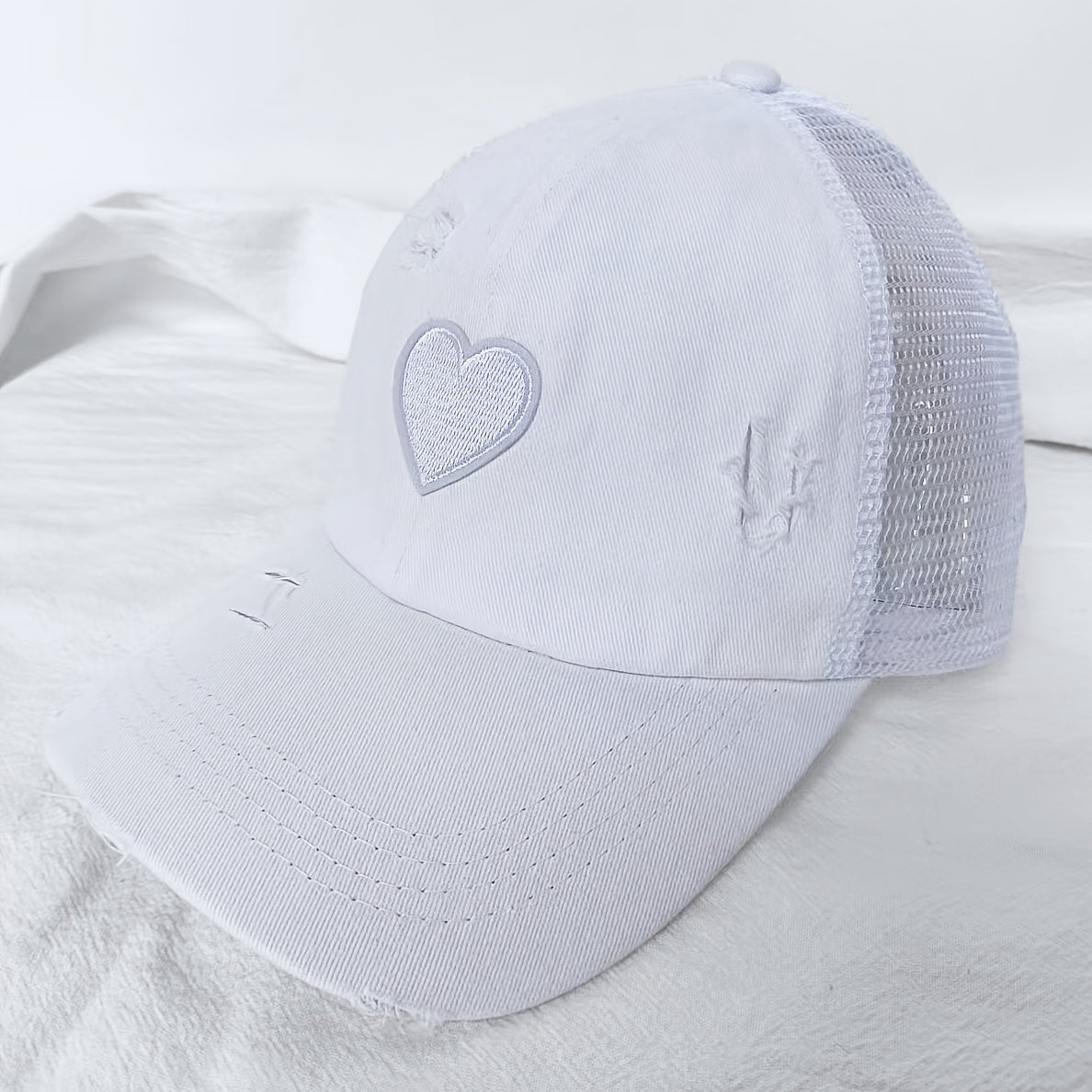 Noor – Verweerde Truckerpet met Hartdetail